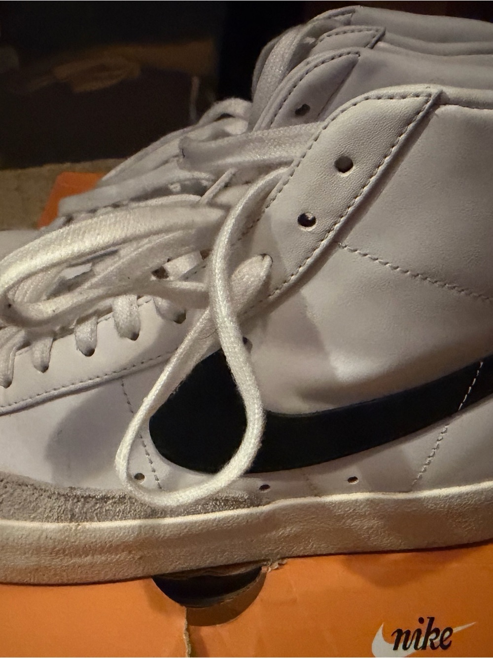 Nike White High-Top Sneakers with Black Swoosh